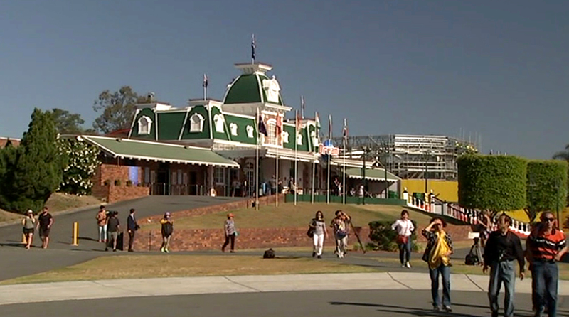 Tourists walk outside Dreamworld in the Gold Coast, Australia. The park has been closed until further notice. (Image: AP)